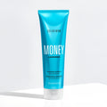 Blue shampoo bottle labeled 'Color Wow Money Laundering Hydrating Shampoo' on a white background